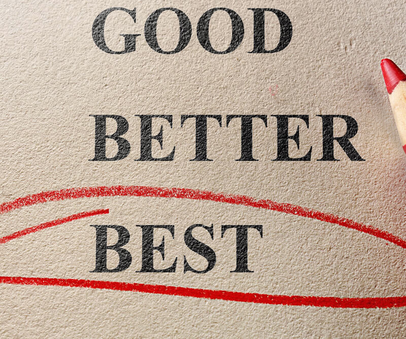 Text reading “GOOD,” “BETTER,” and “BEST” on a textured beige surface, with “BEST” circled in red crayon—highlighting your choice for the best roofing company. A red crayon tip appears in the top right corner of the image.